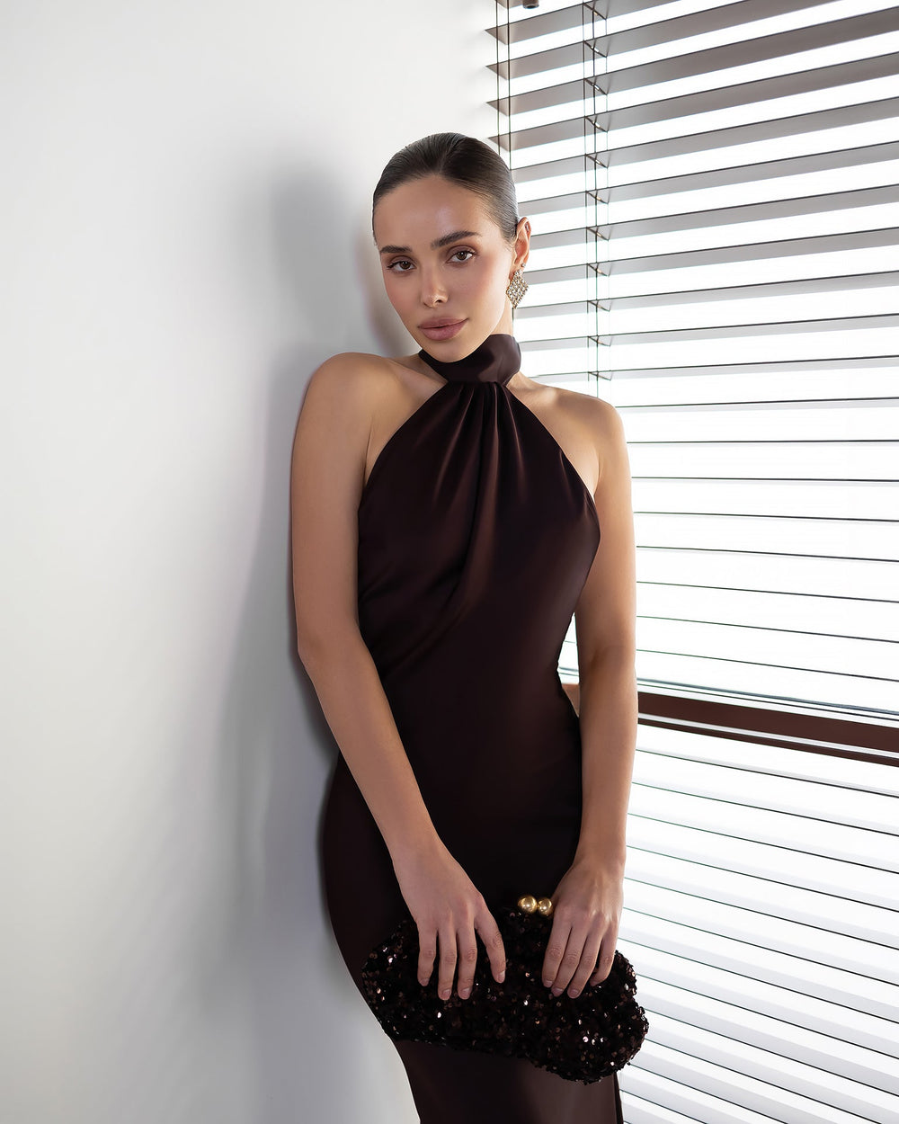 Lunarelle Dress black, front view with hand on hair