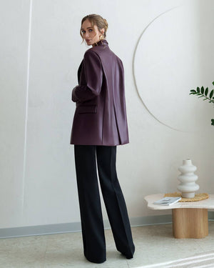 Model in burgundy Morena Pants with coordinating cardigan displaying styling