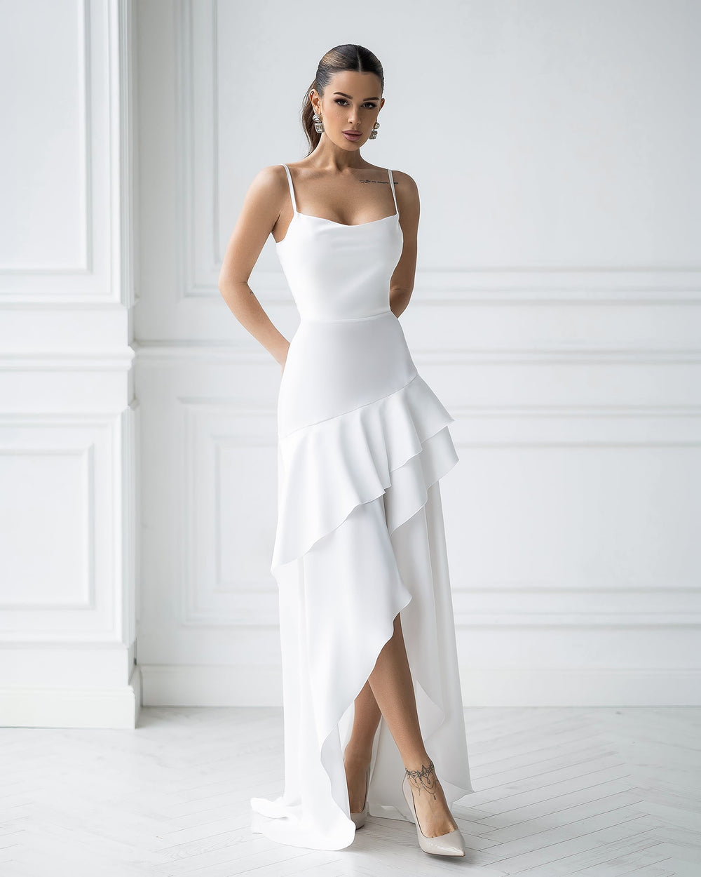 Orselia Dress in white, close-up of ruffled detail at hem