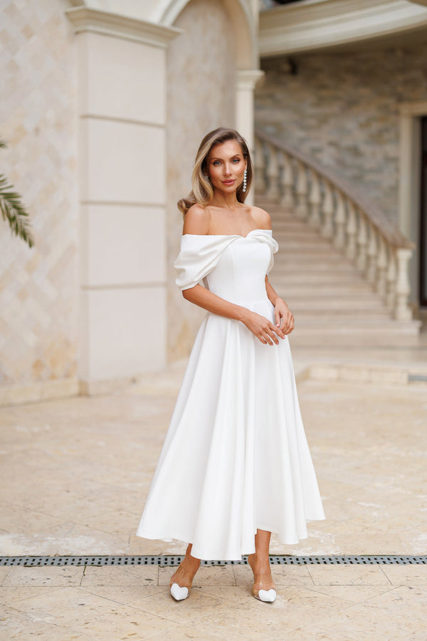 Elvoria Dress in black, back view, draped sleeves