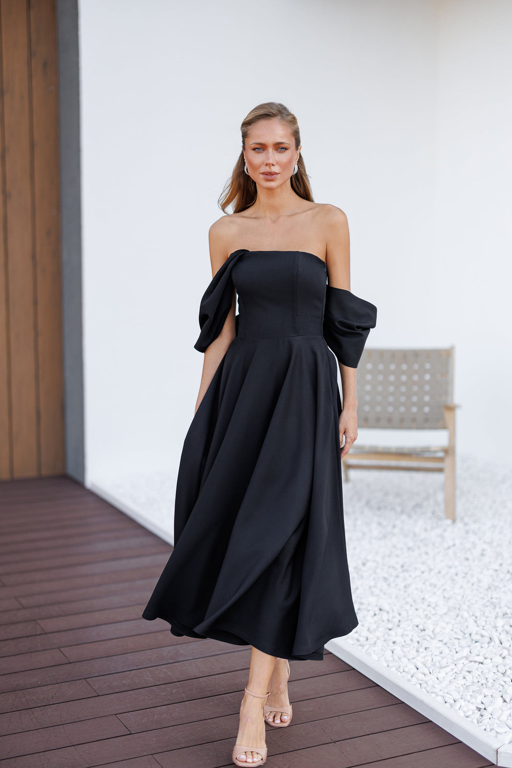 Almirelle Dress in black, off-shoulder profile showing silhouette