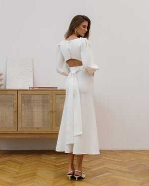 Eloise Dress in beige, back view, flared silhouette