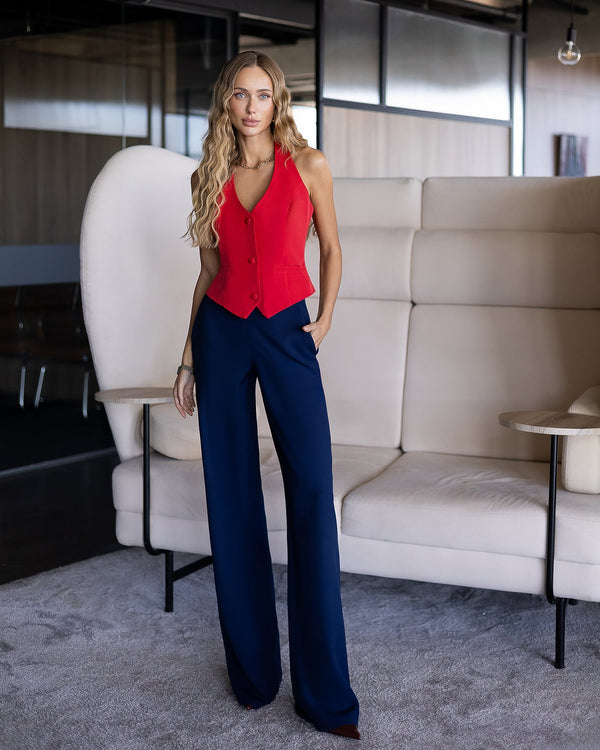 Callistra Vest in red with navy trousers, complete front view