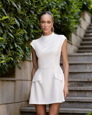 Clara Mini Dress in white, front view on stairs