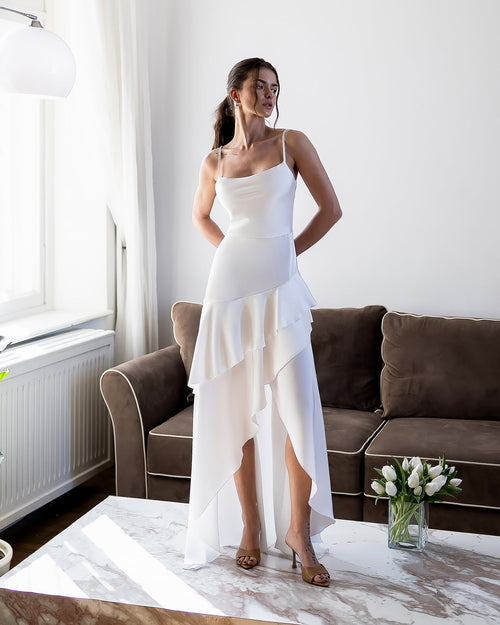Orselia Dress in black, full-length standing indoor view