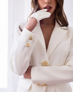 Almira Suit in white, close-up of jacket closure