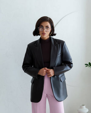 Model in black Morena Pants showing polished evening office look