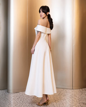Calyra Dress in white, side view showing off-shoulder detail