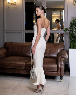 Ravellia Dress in black, standing pose indoors