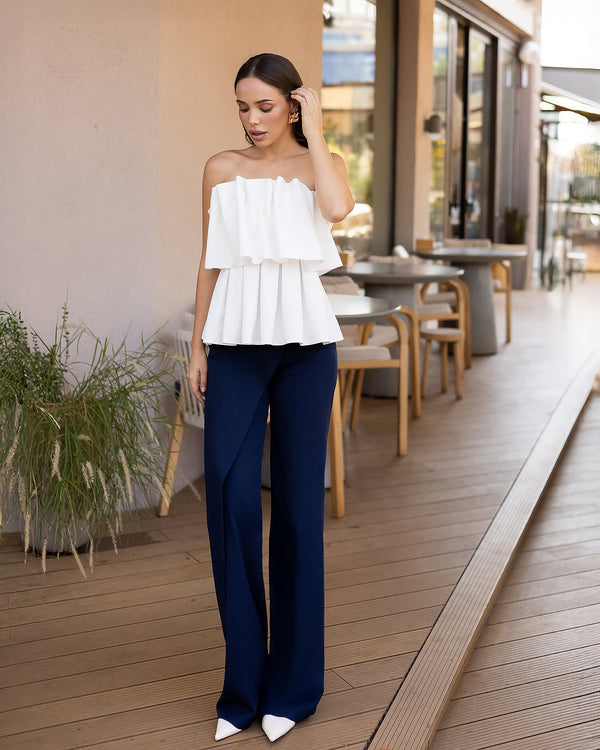 Dahlia Pants in white, back view on exterior
