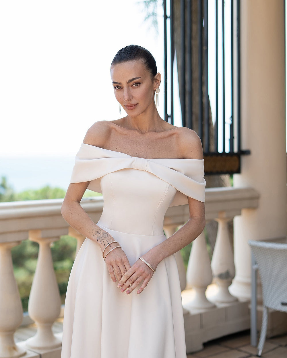 Amour Bridal Dress in cream ivory, close-up of wrap front