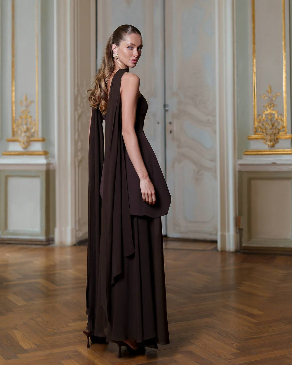 Annabelle Dress in black, back view with flowing skirt
