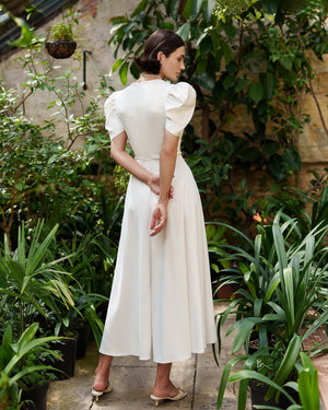 Arabella Dress in white, side profile showing elegance