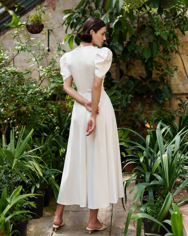 Arabella Dress in white, side profile showing elegance