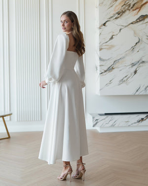 Aria Dress in white, side profile on model