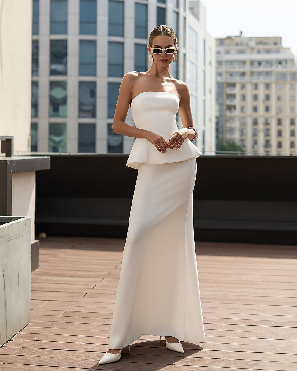 Celestia Bridal Bandeau Suit in white, back view on urban deck setting