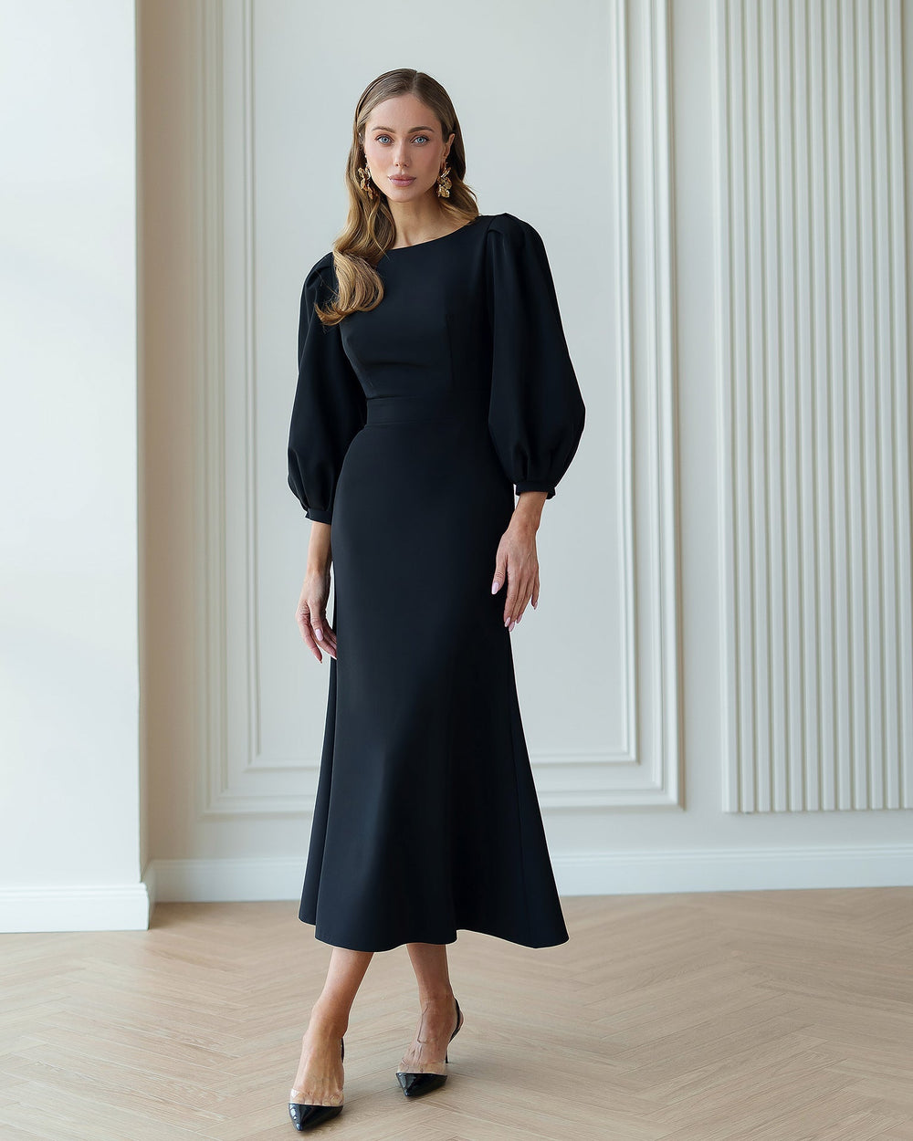 Eloise Dress in black, seated front view