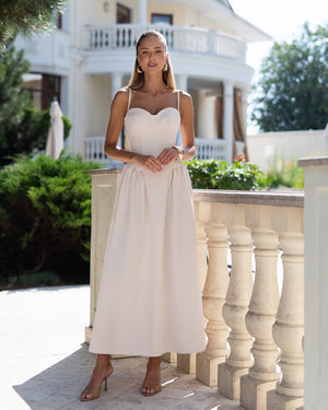 Odette Midi Dress in black, outdoor full-length standing pose