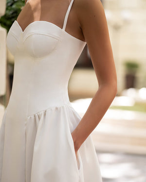 Odette Midi Dress in black, back view in daylight setting
