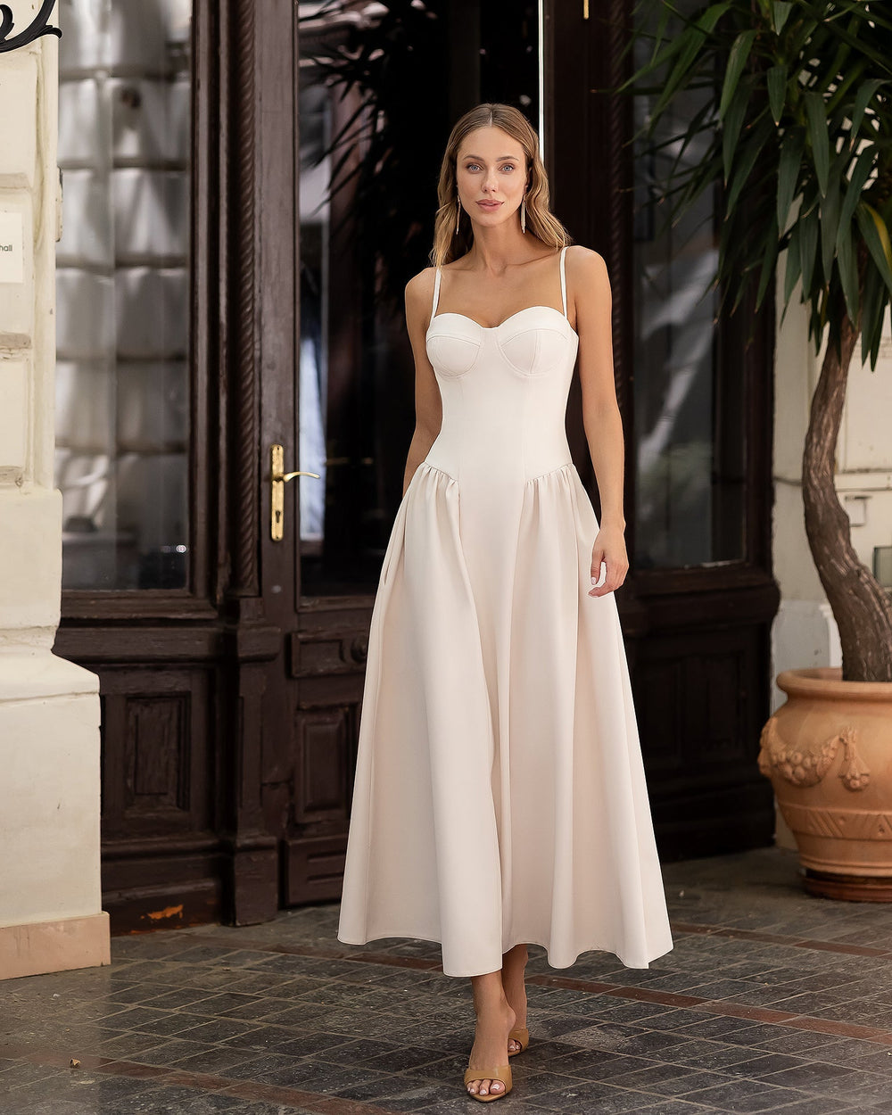 Odette Bridal Midi Dress in white, standing view in luxury setting