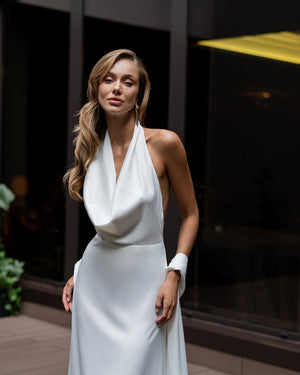Odile Gown in white, back view outdoor setting on grand stairs