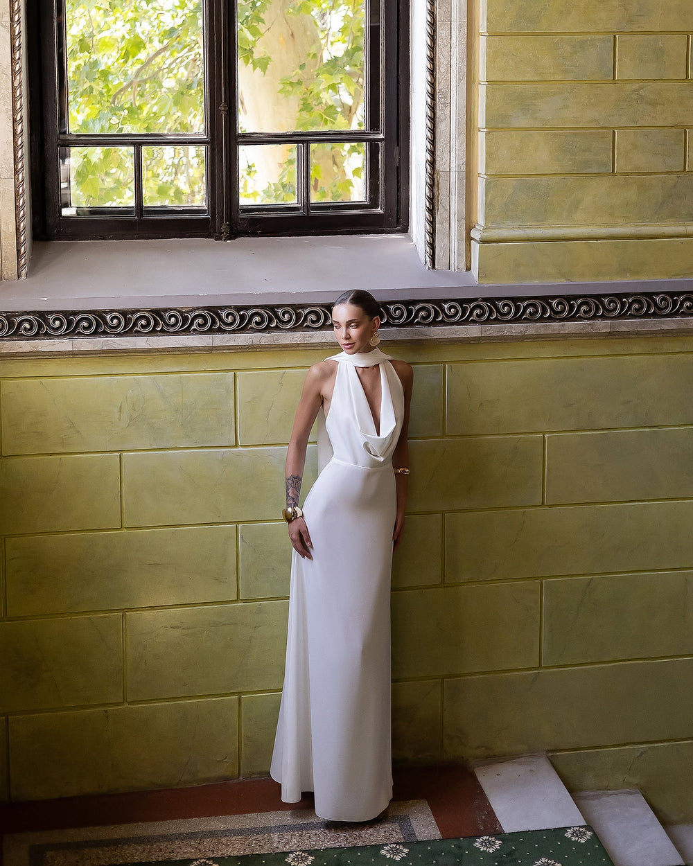 Odile Gown in black, back view outdoor setting showing open-back