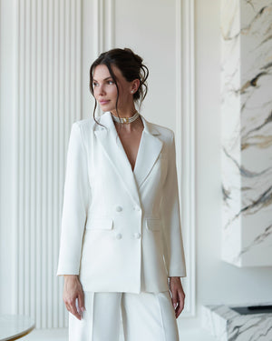 Regal Trinity Suit in cream, back view outdoor