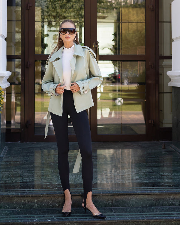 Model wearing khaki Narella coat showing full-length profile